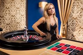 Joker Gaming responsive design on mobile phone screen showing bet controls and spin button
